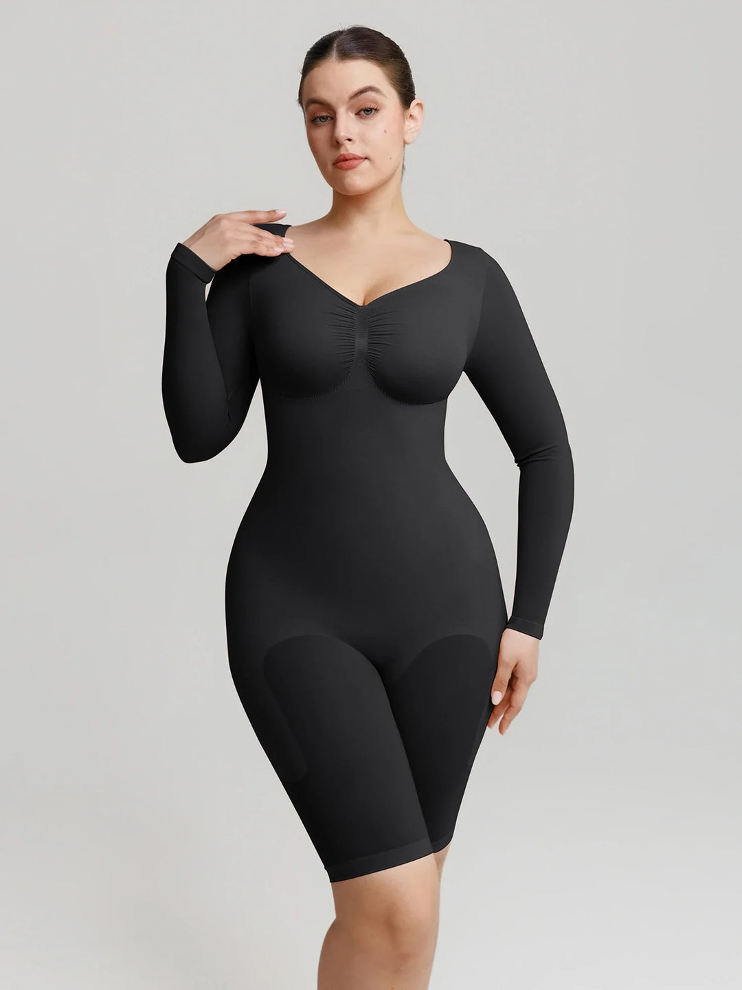 Ultra-stretch seamless shapewear top with targeted tummy control, ruched bust support, and breathable second-skin comfort, designed for versatile everyday wear from layering essential to stylish outerwear.