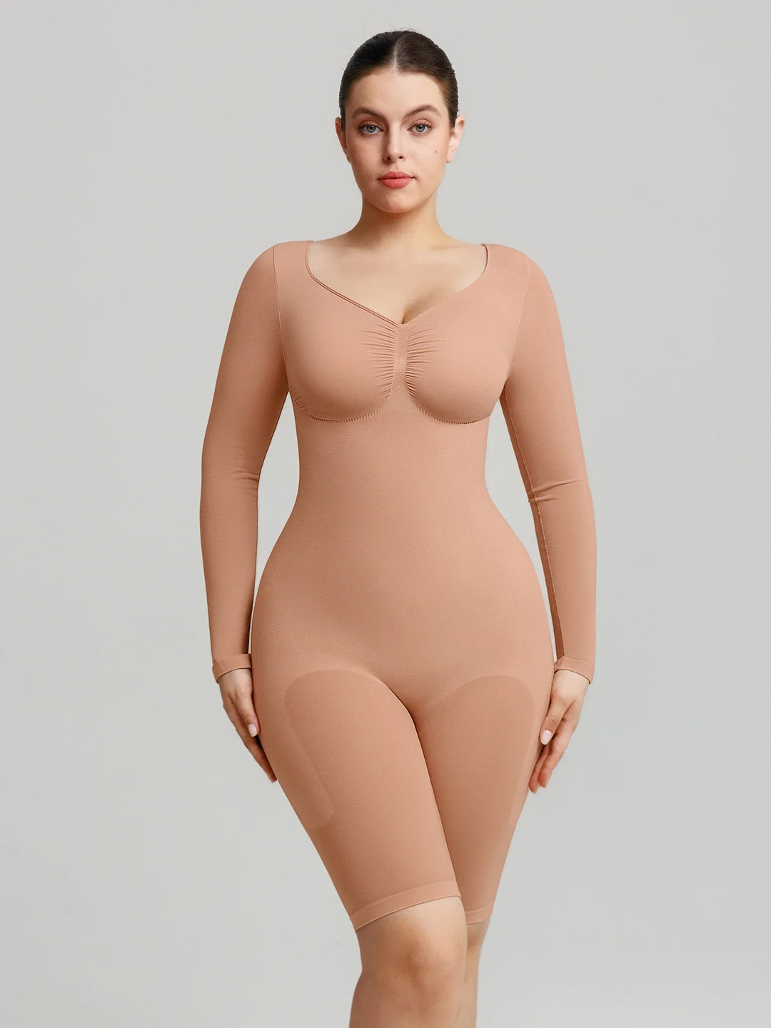 Ultra-stretch seamless shapewear top with targeted tummy control, ruched bust support, and breathable second-skin comfort, designed for versatile everyday wear from layering essential to stylish outerwear.