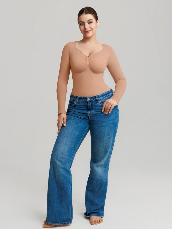 Ultra-stretch seamless shapewear top with targeted tummy control, ruched bust support, and breathable second-skin comfort, designed for versatile everyday wear from layering essential to stylish outerwear.