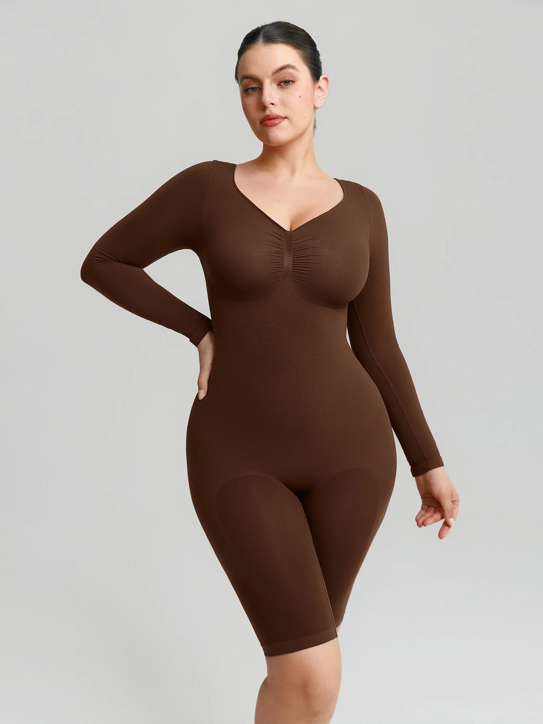 Ultra-stretch seamless shapewear top with targeted tummy control, ruched bust support, and breathable second-skin comfort, designed for versatile everyday wear from layering essential to stylish outerwear.