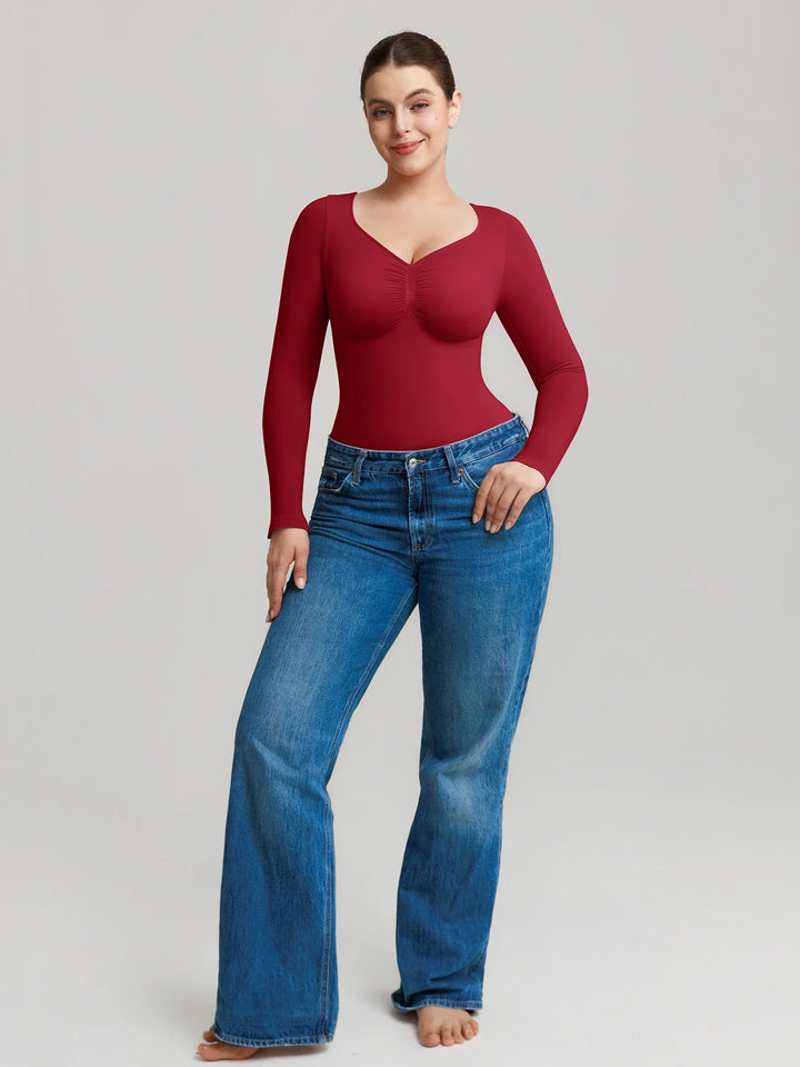 Ultra-stretch seamless shapewear top with targeted tummy control, ruched bust support, and breathable second-skin comfort, designed for versatile everyday wear from layering essential to stylish outerwear.