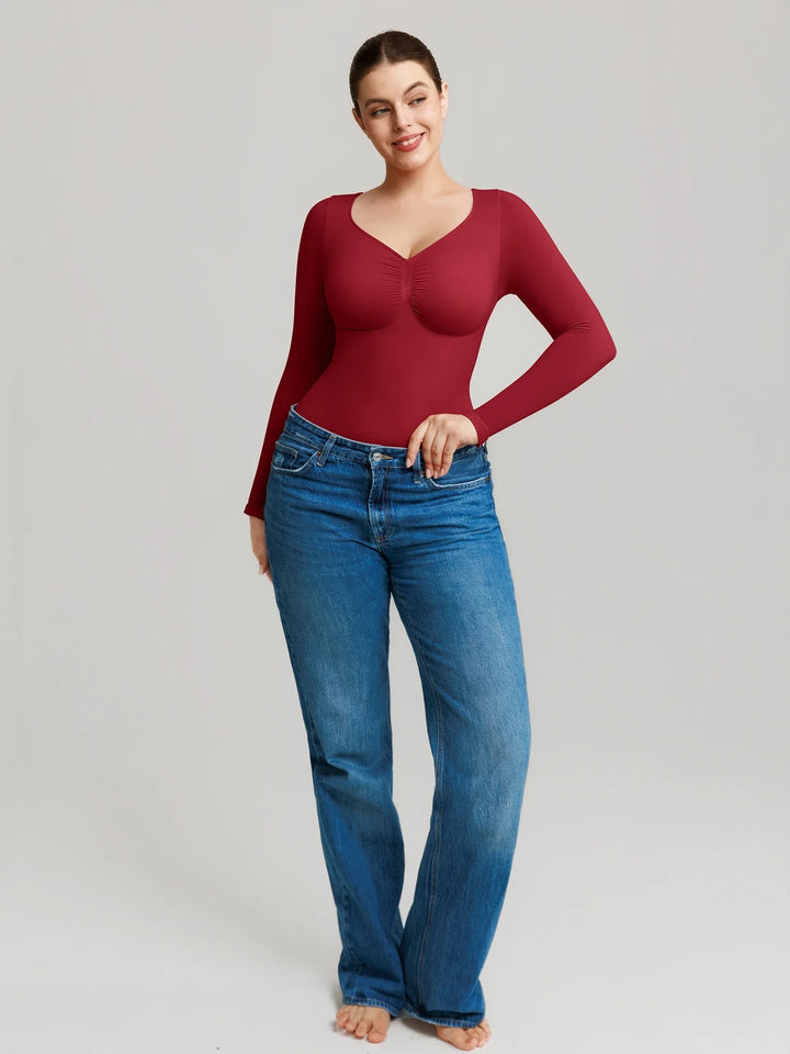 Ultra-stretch seamless shapewear top with targeted tummy control, ruched bust support, and breathable second-skin comfort, designed for versatile everyday wear from layering essential to stylish outerwear.